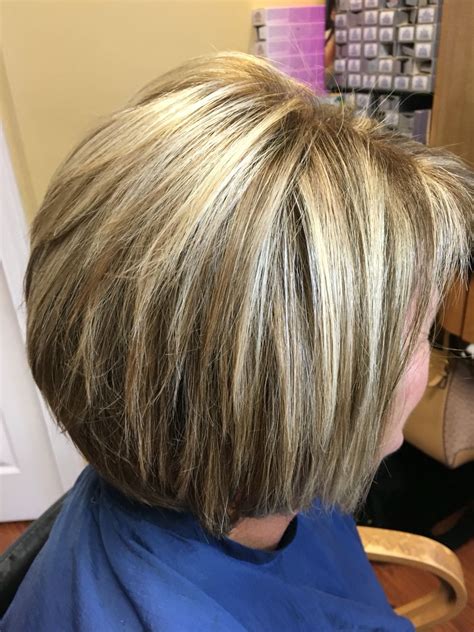 Fine hair can instantly look thicker with the help of highlights and lowlights as they create depth and contrast. Blonde highlights and lowlights for this short hair cut ...