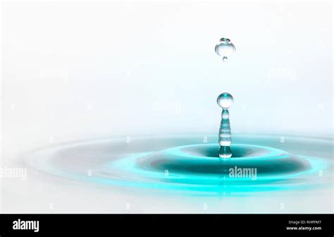 Turquoise Blue Magic Waterdrop Column On Bright White Background Stock
