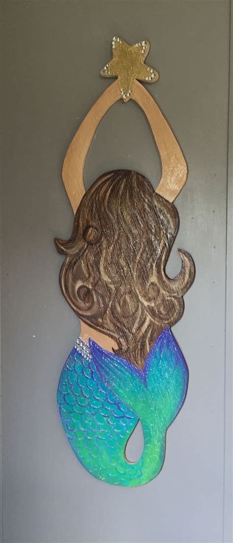 I painted this mermaid door hanger with purples, blues and greens. | Door hangers, Wood door ...
