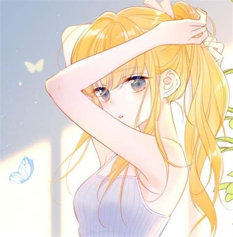 A Girl With Long Blonde Hair And Blue Eyes Holding Her Hand To Her Head