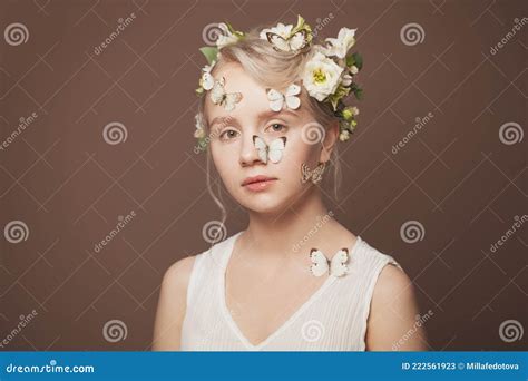 Beautiful Blond Fashion Model With Flowers In Her Hair Pretty Woman With Nude Makeup Stock