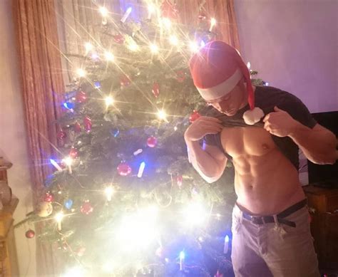 Santa Claus Pulling T Shir Up And Showing Pecs