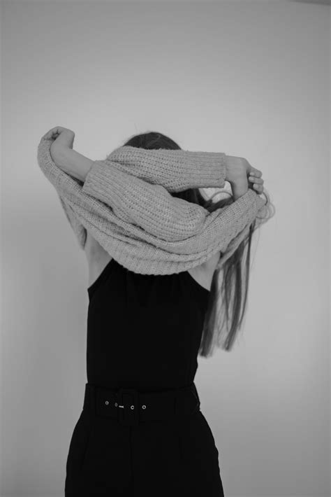 A Woman Taking Off Her Sweater · Free Stock Photo