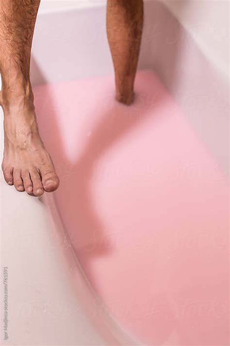 Bathea Man In A Bathtub Filled With Pink Waterlegs By Igor Madjinca