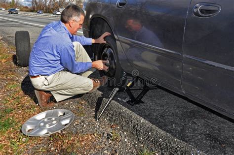 Man Changing Flat Tire Stock Image Image Of Travel Jack
