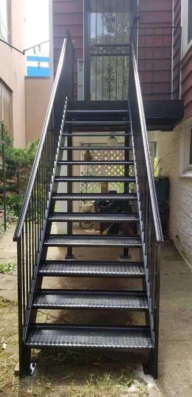 This outdoor staircase is pure elegance, as it is made up of 100% pure timber and is supported with metal frames. Steel and Metal Staircases - Steel Masters NYC