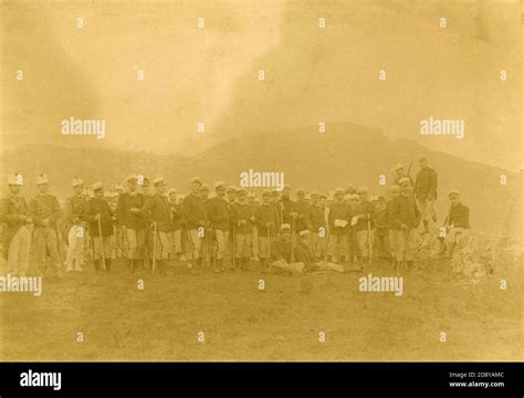 Old Army Of Uniformed Soldiers Resting In The Field 1880s Stock Photo