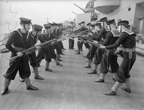 Royal Navy Ratings Face Each Other During Bayonet Practice Onboard Hms