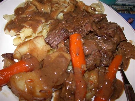 Then, placed the animal meat alongside onions, garlic and bay renders from a roaster pan. are you eating that?: Paula Deen's and Eddie's Pot Roast