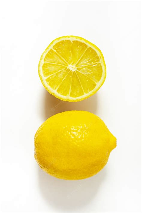 Premium Photo Isolated Lemon And Half A Lemon On A White Background