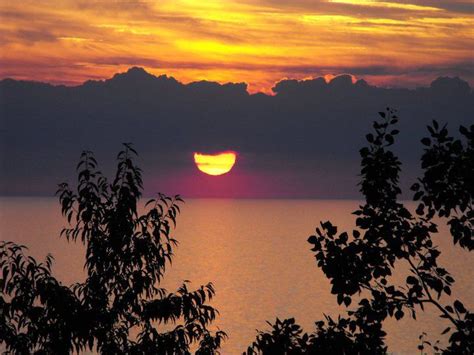 Sun Setting Over Lake Erie Below Storm Clouds Smithsonian Photo