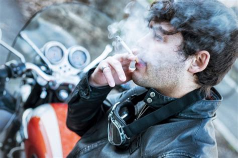 Biker Smoking Cigarette Stock Photo Download Image Now Istock