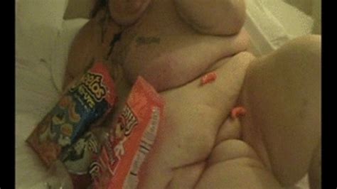 Sinfully Divine Ssbbw Naked On The Bed Stuffing Her Face With Cheetos