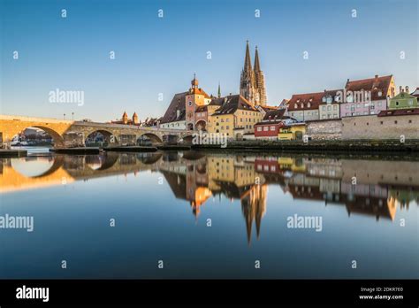 Famous City View Of Regensburg And Promenade With Stone Bridge The