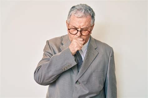 Senior Grey Haired Man Wearing Business Suit Feeling Unwell And