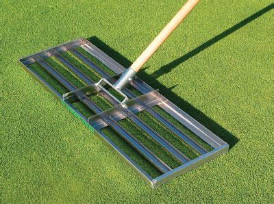 I need to bring up a low area in my lawn next to my walkway and paver parking area. top dress rake - Google Search