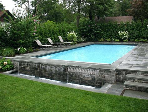 Apart from it they are quite cost effective to use it for enjoyment and good experience during the season. Infinity Swimming Pool Designs Raised Black Tile And Spa ...
