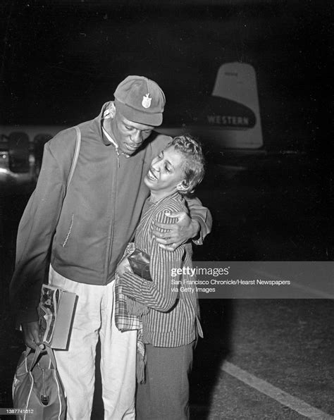 Bill Russell Greets His Fiancee Rose Swisher As He Arrives At The San