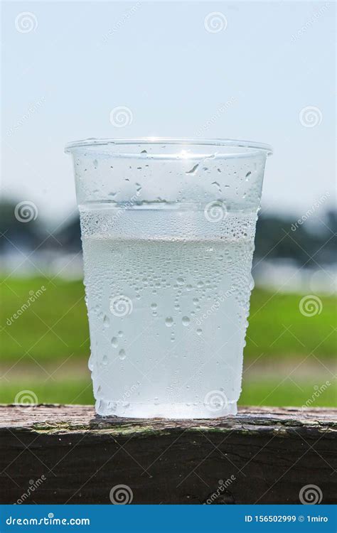 Plastic Cup Half Full Of Water To Show The Ice Melted Outdoor Stock