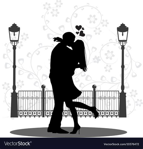 Silhouette Of A Young Couple Kissing On Street Vector Image