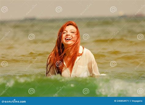 Redhead Woman Playing In Water During Summertime Stock Image Image Of