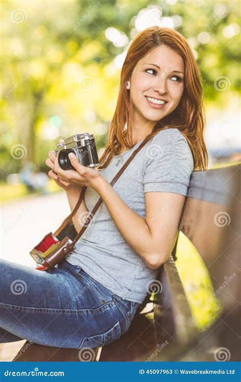 Redhead Sitting On Bench Using Her Camera Stock Image Image Of Countryside Lawn 45097963