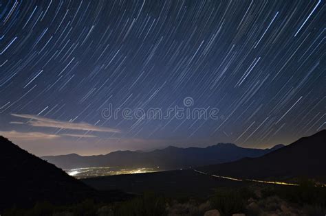 Night Sky With Star Trails And Meteor Streaks Over Mountain Range