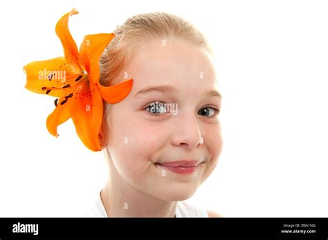 Portrait Of Young Girl With Orange Lily In Her Hairs Over White