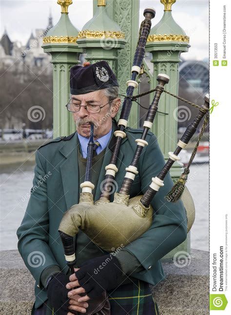 Time changes in england are usually done to adapt citizen and tourist activity to the solar cycle. Scotsman Playing The Bagpipes Editorial Stock Photo ...