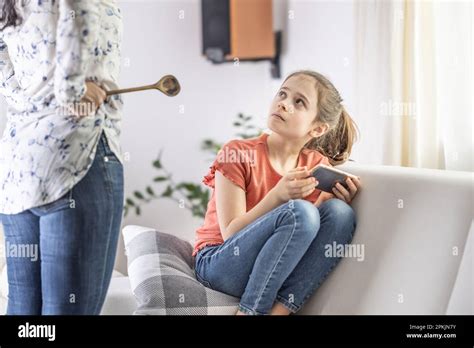 Mother Daughter Disagreement With Strict Mother Telling Girl Off For