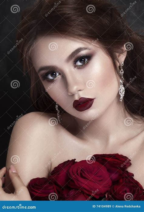 Beauty Fashion Model Girl Portrait With Red Roses Lips And Nails