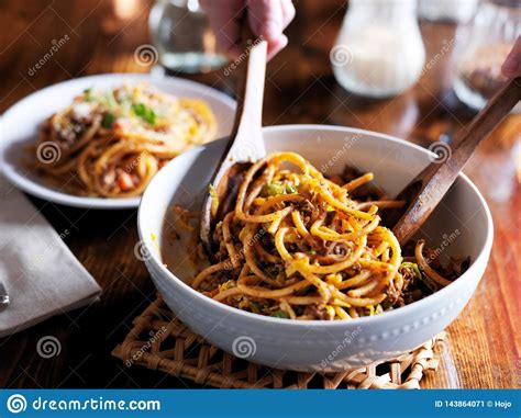 Serving Spaghetti with Wooden Spoons Out of Bowl Stock Image - Image of ...