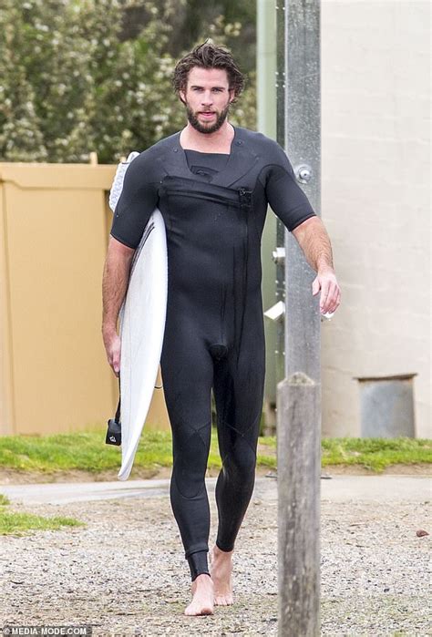 Liam Hemsworth Wears Snug Wetsuit As He Emerges From The Surf Hot