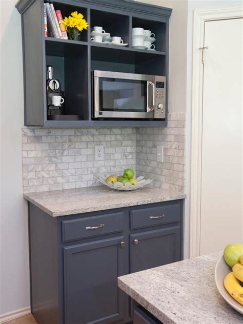 Our stock of cabinetry includes wall cabinets that hang above counters to store dishes, glasses, baking supplies, and more. Open Shelving Houses Microwave in Neutral Kitchen | HGTV