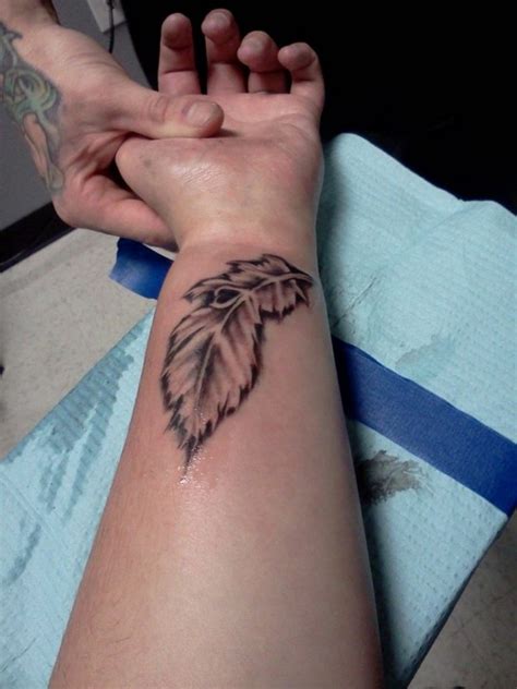 Attractive Wrist Feather Tattoos