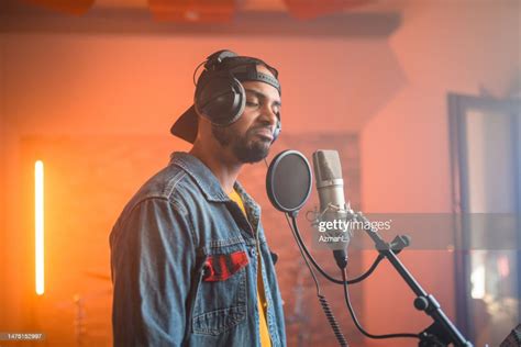 Young Hip Hop Singer Recording Music In Recording Studio High Res Stock