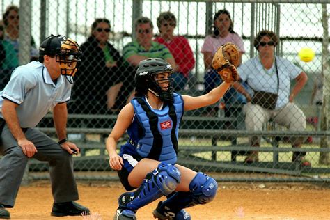 Woman Catching Ball Wearing Catchers Gear · Free Stock Photo