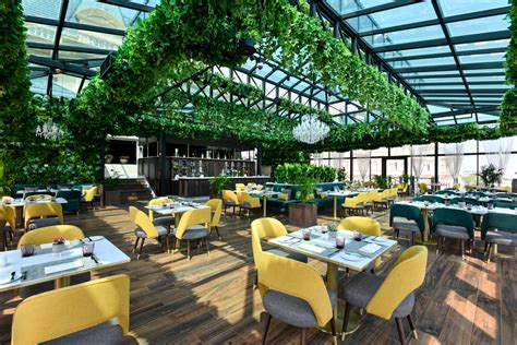 Greenery Filled Restaurant Glass House Opens At Al