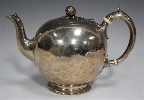 A Victorian Silver Teapot Of Bullet Form With Hinged Lid And Fruit