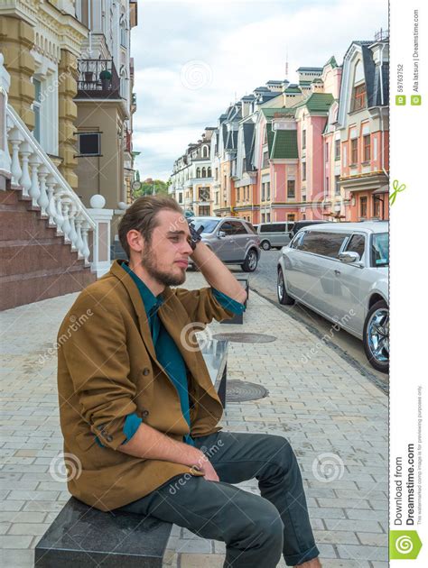 A Young Man Sitting On A Bench Stock Photo Image Of Break