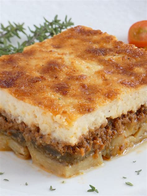 A rich tomato meat sauce layered with eggplant instead of pasta sheets, and topped with a. Traditional Greek Moussaka | my baking saga