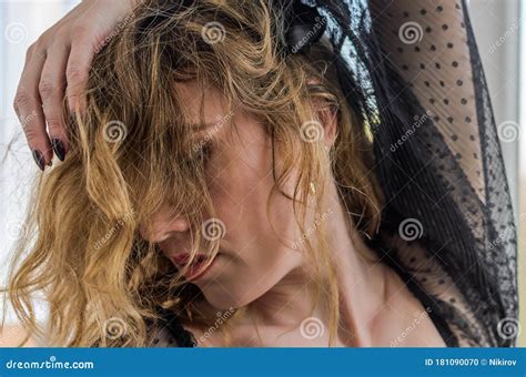 Portrait Of A Girl Covering Her Face With Her Long Hair Stock Photo