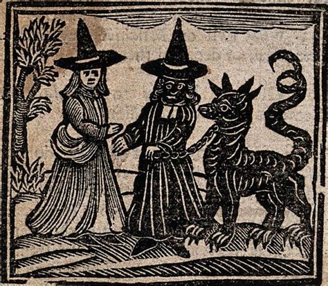 An Old Book With Two Witches And A Cat On Its Cover In Black Ink