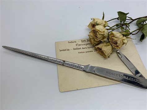 Letter Opener Marked As A Ruler With Centimetres On One Side And Inches