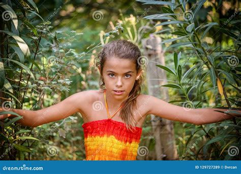 Portrait Of A Young Girl In The Bushes Stock Image Image Of Eyes Innocence 129727289