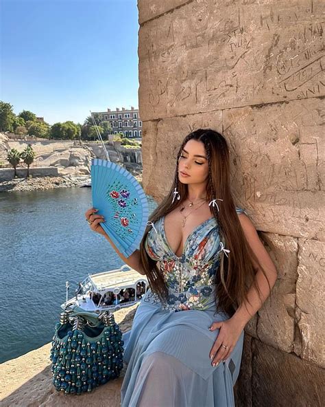 Demi Rose Puts On A Very Busty Display In A Plunging Blue Patterned