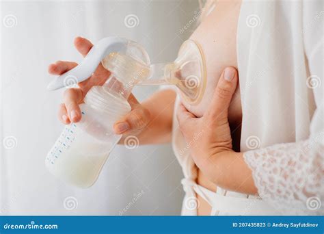 A Woman Uses A Breast Pump Improved Lactation Breast Milk Supply