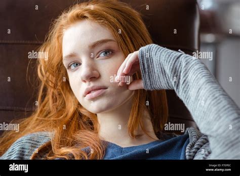 Portrait Of A Charming Redhead Woman Looking At Camera Stock Photo Alamy