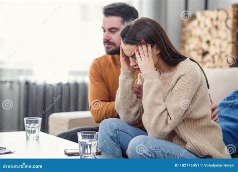 Young Loving Wife Supporting Her Depressed Husband During Psychotherapy