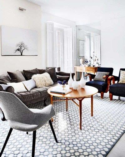 A simple palette dominated by black and white gives off a sleek, modern vibe. grey themed living room | Rustic living room | Pinterest